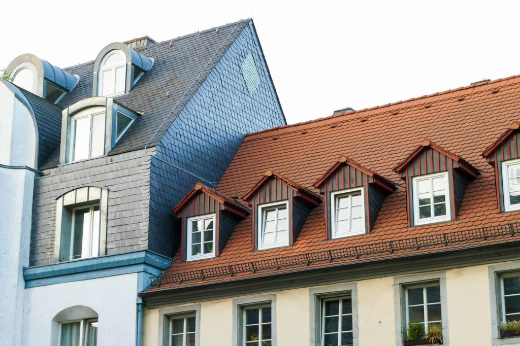 a group of buildings with dormers